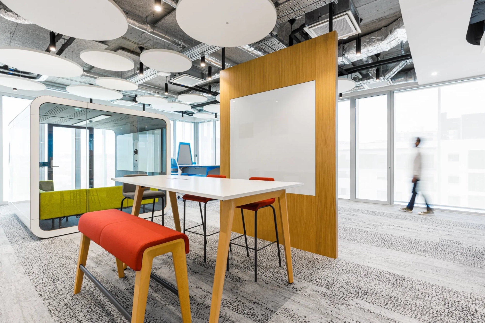 a room with a white board and tables